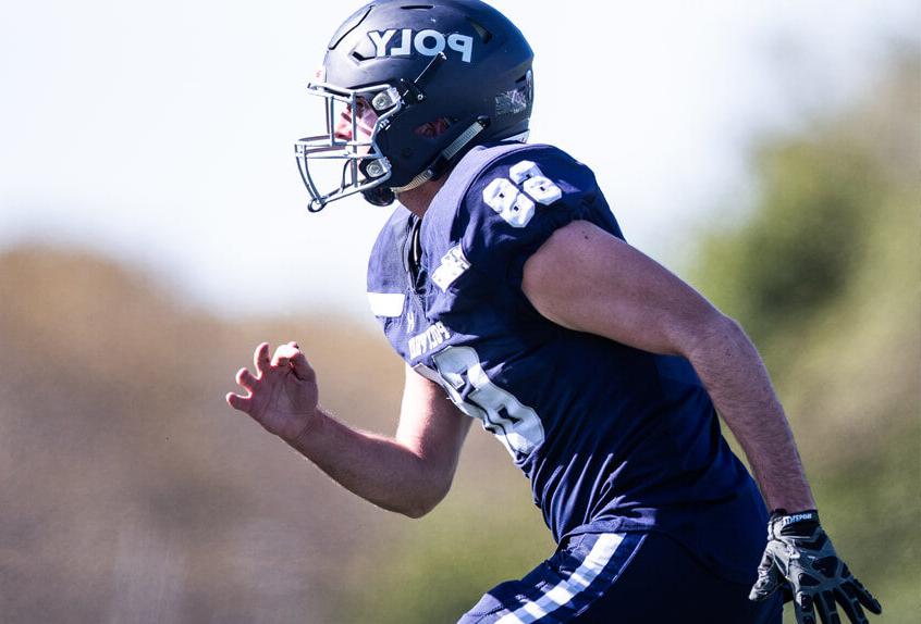 Poly Prep Varsity Team football player running