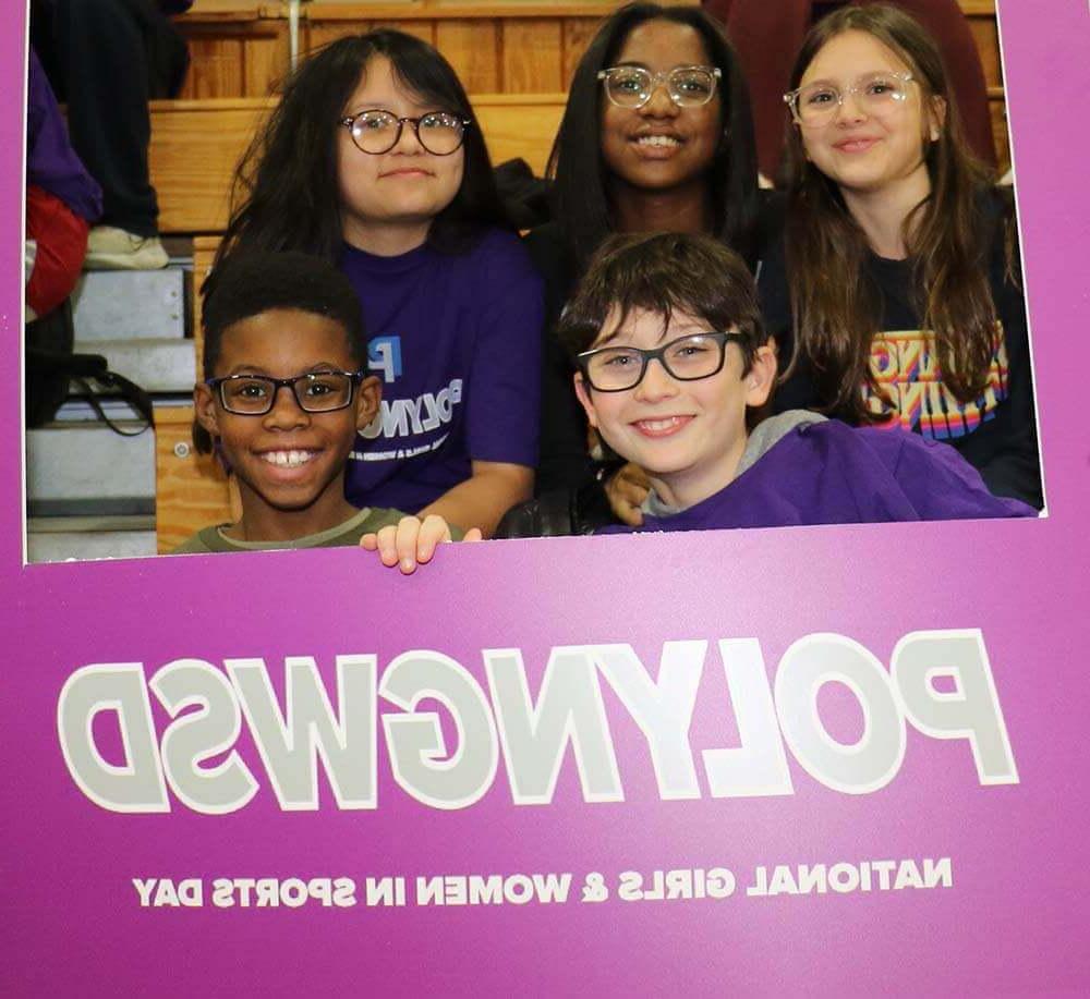 Middle School kids celebrating National Girls and Women in Sports Day.